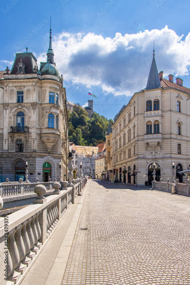 Fototapeta premium Main street of the city center, Stritarjeva ulica with Ljubljana castle, Ljubljanski grad, Ljubljana, Slovenia.