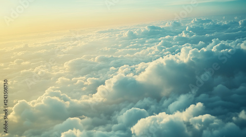 Profile of a traveler looking out from an airplane window, with clouds below.

