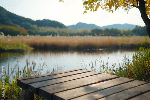 P A rustic scene of a wooden bridge over a tr photo