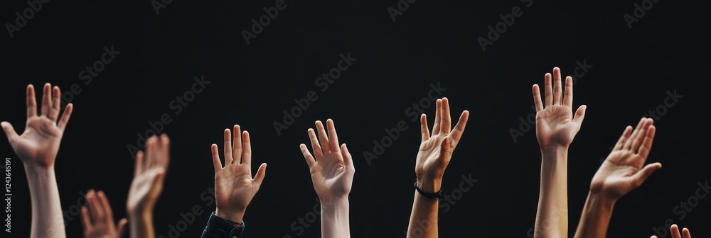 At a lively conference, participants eagerly raise their hands, showing enthusiasm to engage in discussions, set against a striking black backdrop that enhances the events atmosphere At a lively conference, participants eagerly raise their hands, showing enthusiasm to engage in discussions, set against a striking black backdrop that enhances the events atmosphere