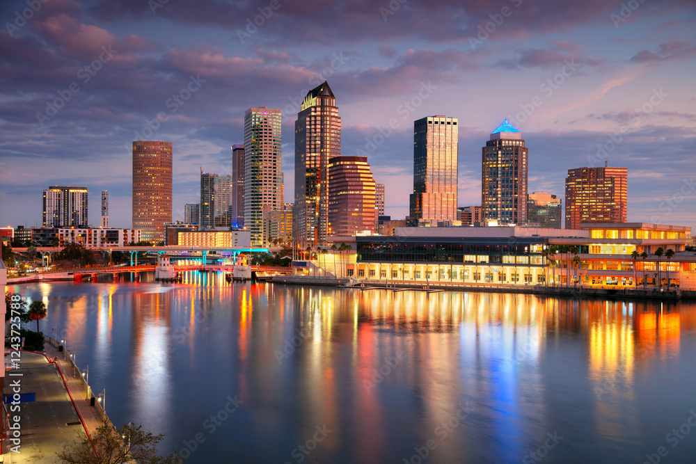 Tampa, Florida, USA. Aerial cityscape image of Tampa, Florida with reflection of the city skyline in the water at beautiful sunrise.