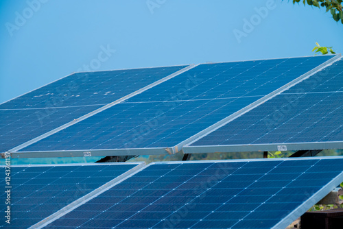 Solar powered panels are installed in farmlands or fields or farms. Rows of sustainable energy solar panels installed on farmland meadow rural field