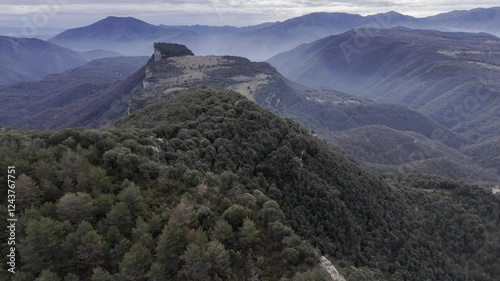 Rupit is a charming medieval village with a suspension bridge and stone houses. Nearby, Salt de Sallent, Catalonia’s tallest waterfall, cascades 115 meters down limestone cliffs. Tavertet, sitting ato photo