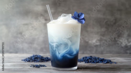 Butterfly Pea Blue Tea with flowers and milk. A glass of a cold summer drink. Caffeine free drink. Healthy food concept photo