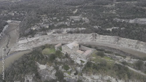 Located on a stunning meander of the Ter River, this 11th-century Benedictine monastery is a jewel of Catalan Romanesque architecture. It offers breathtaking panoramic views and is steeped in history  photo