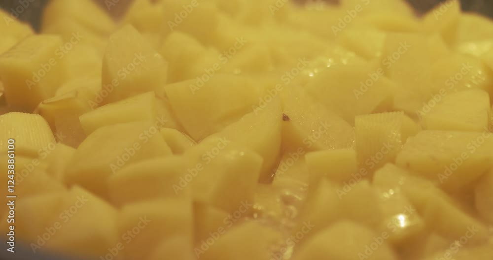 Pieces of potato fried on hot oil 4K panning video Pieces of potato fried on hot oil 4K panning video