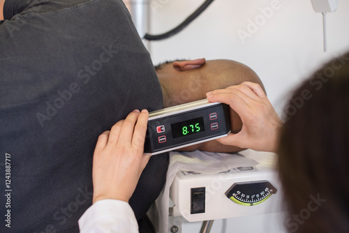 Doctor measuring the patients neck atlas