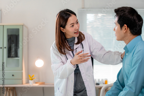 Doctor reassuring her patient by touching his shoulder and giving him medical advice