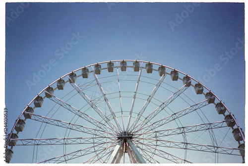 Ferris Wheel Against Clear Blue Sky photo