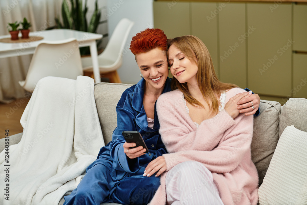Fototapeta premium Joyful moments shared in a modern apartment between a young lesbian couple