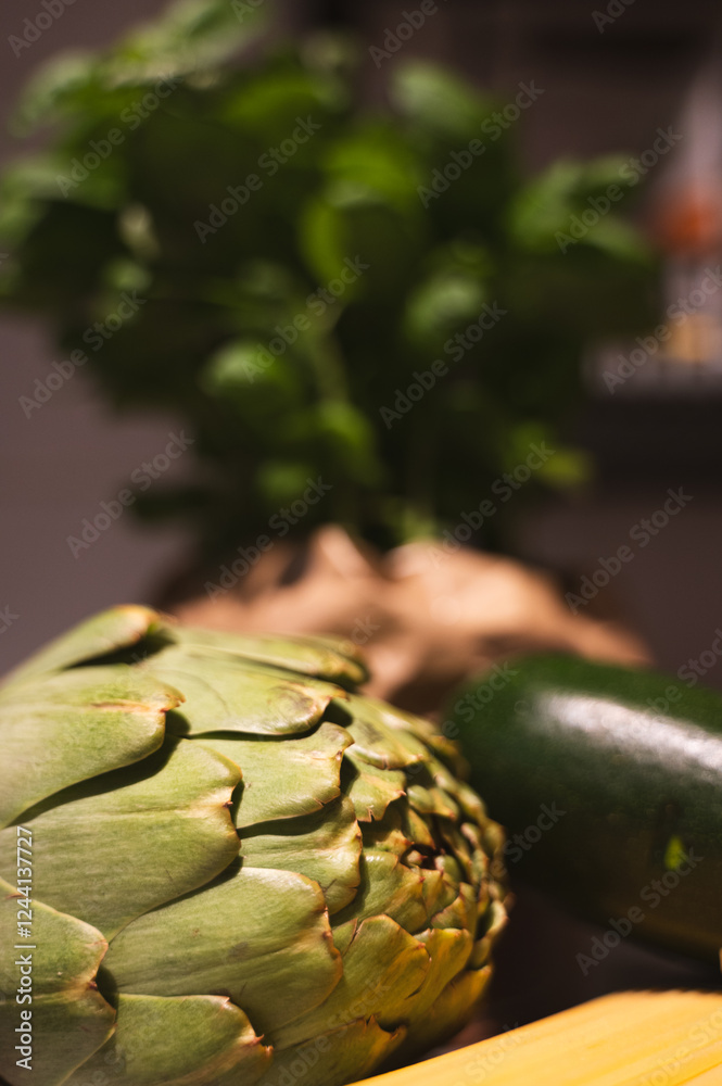 Fototapeta premium fresh artichokes on a wooden table