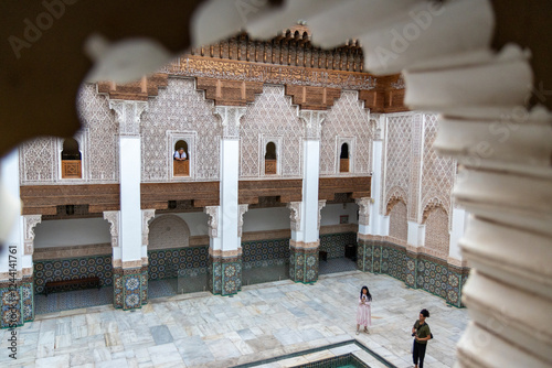 Madrassa Ben Youssef, 16th century university building with prayer room and decorated patio with railings and sculpted whip. Marrakech, Morocco