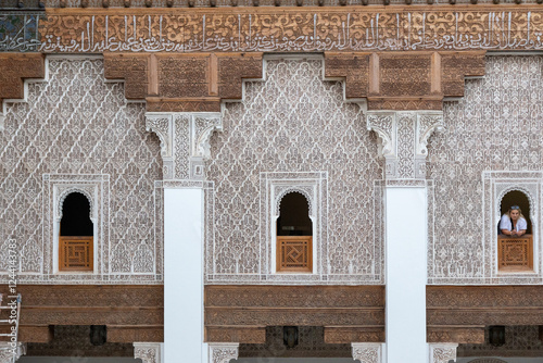 Madrassa Ben Youssef, 16th century university building with prayer room and decorated patio with railings and sculpted whip. Marrakech, Morocco