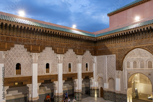 Madrassa Ben Youssef, 16th century university building with prayer room and decorated patio with railings and sculpted whip. Marrakech, Morocco