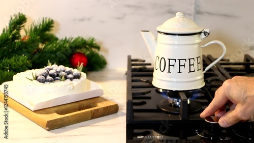 A man pours coffee in the kitchen.