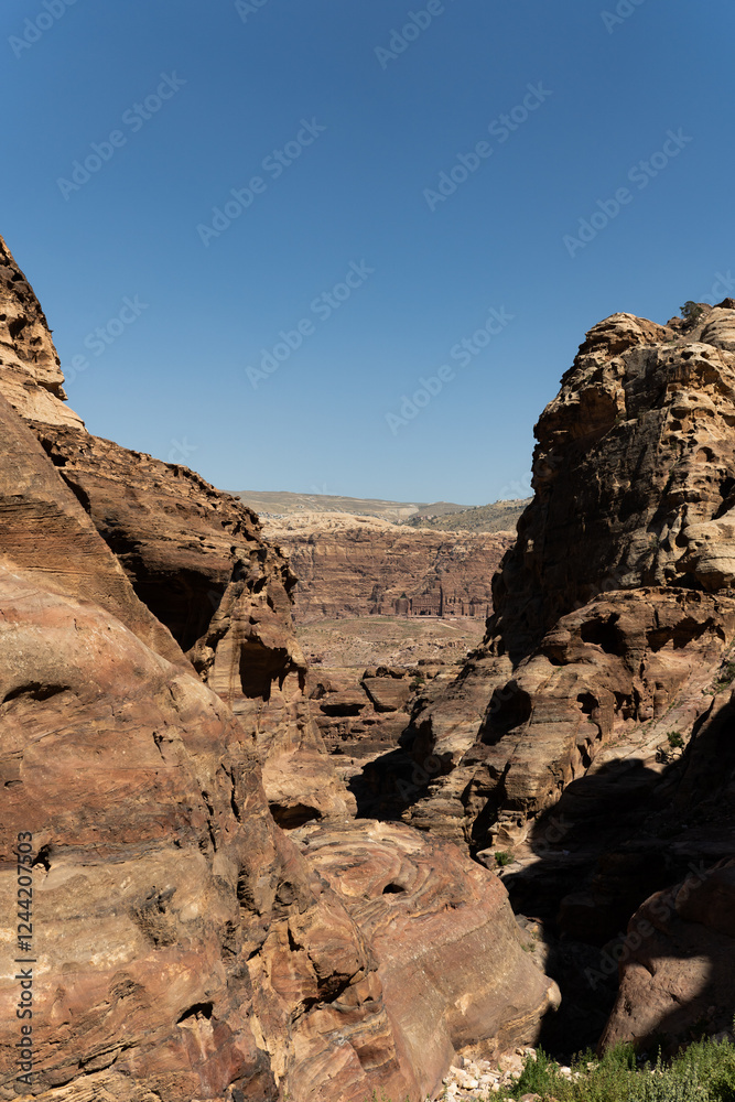 Rugged red cliffs and vast sandy expanses create a mesmerizing desert scene. Rugged red cliffs and vast sandy expanses create a mesmerizing desert scene.