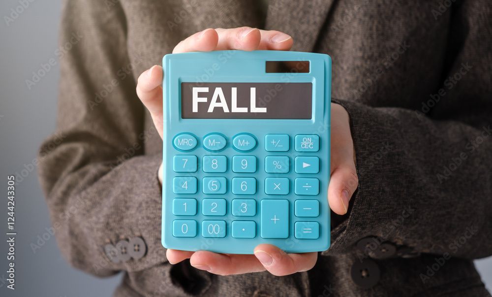 Young business woman pointing on calculator. Taxes business concept Calculator with Fall on display white background. Young business woman pointing on calculator. Taxes business concept Calculator with Fall on display white background.