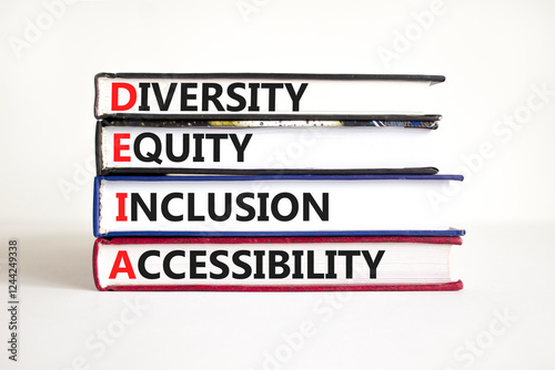 DEIA symbol. Concept words DEIA diversity equity inclusion accessibility on books. Beautiful white background. Business DEIA diversity equity inclusion accessibility concept. Copy space.