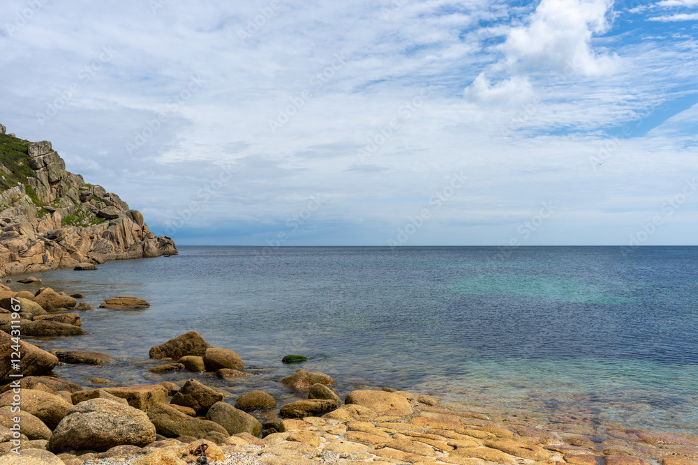 Rocky headland on the English South Coast with still sea and high clouds. Flat economy, challenging growth. Rocky headland on the English South Coast with still sea and high clouds. Flat economy, challenging growth.