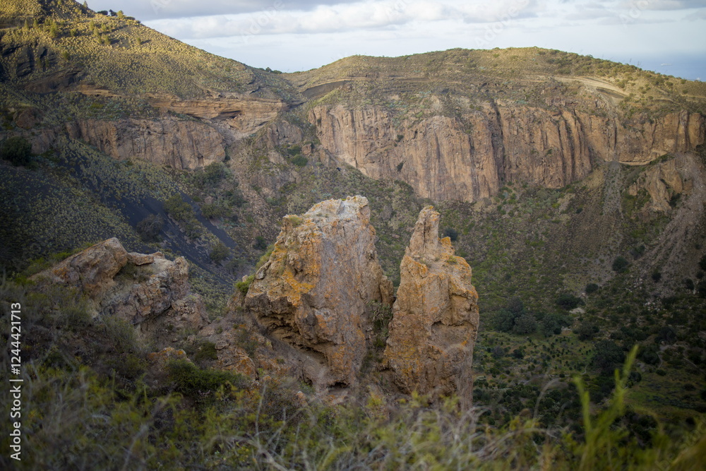 Rugged mountain landscape Bandama Caldera, Gran Canaria, with a prominent rock cliff or outcrop.
