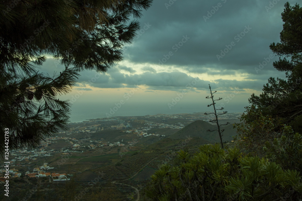 Mountainous landscape in Gran Canaria near Bandama, with a winding road and a small village.
