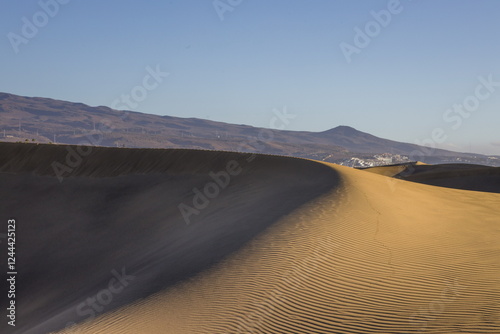 Obraz na płótnie Maspalomas Dunes in Gran Canaria. Textured sand dunes with patterns, shadows, and faint footprints. w salonie