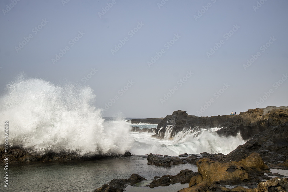 Waves crashing against a rocky shoreline in Gran Canaria.