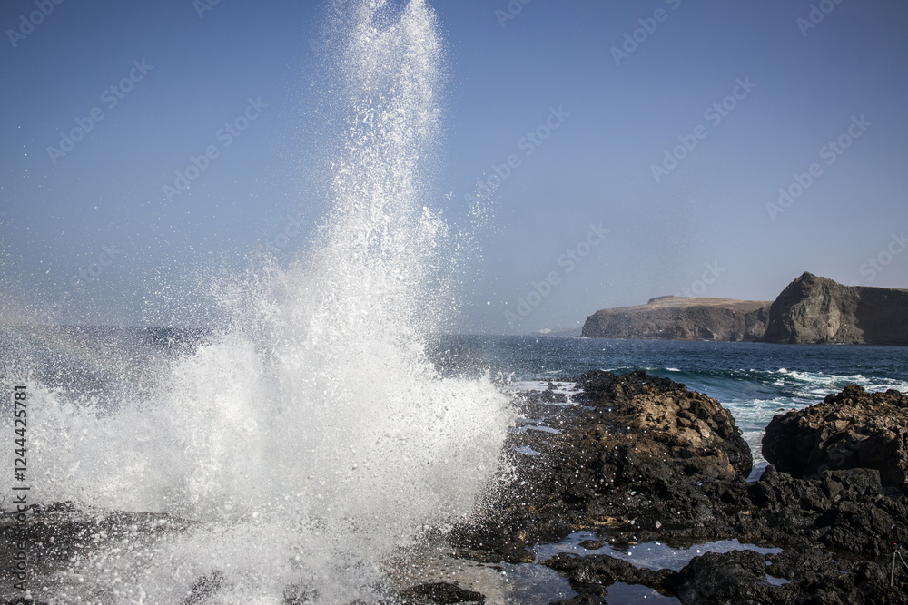 Waves crashing against a rocky shoreline in Gran Canaria.