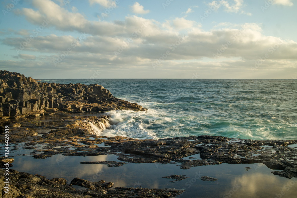 Waves crashing against a rocky shoreline in Gran Canaria.