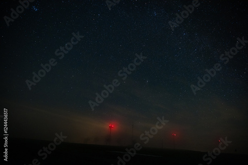 Wind power plant without light polution and sky full of the stars between villages Vendoli and Ostry Kamen, Czech republic photo