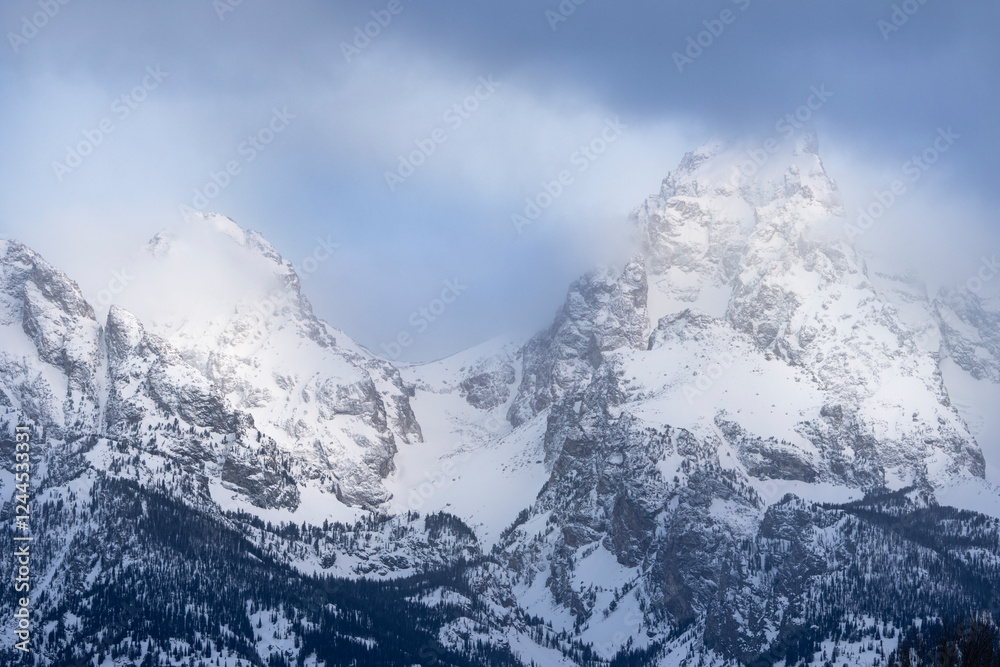 Obraz premium USA, Wyoming, Grand Teton National Park. Spring snowstorm over Teton Range at sunrise.