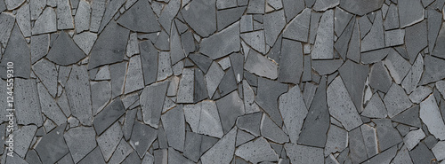 Wall background covered with natural gray limestone with black veins