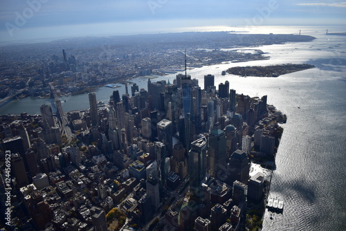 Aerial view of Manhattan’s skyline with skyscrapers, rivers, and streets. Urban landscape, New York City, cityscape, architecture, aerial photography, metropolis, travel, modern city, iconic view