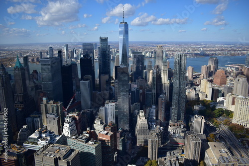 Aerial view of Manhattan’s skyline with skyscrapers, rivers, and streets. Urban landscape, New York City, cityscape, architecture, aerial photography, metropolis, travel, modern city, iconic view