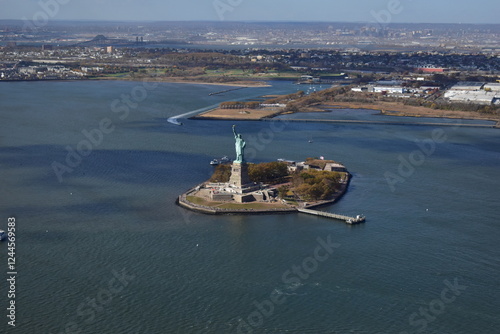 Aerial view of Liberty Island and the Statue of Liberty from a helicopter. Iconic landmark, New York City, tourism, aerial photography, ocean, skyline, history, freedom, travel, USA, island view