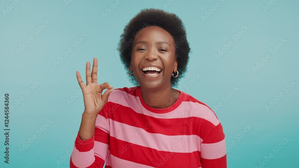 Perfect, hand and face of black woman with gesture, happy review and approval icon in studio. Okay, yes emoji and African person with agreement, laughing and positive feedback on blue background
