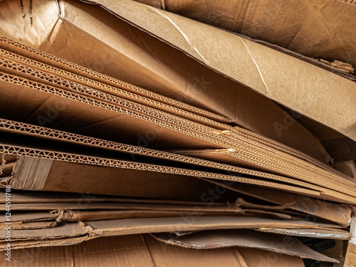 Close-up view of stacked corrugated cardboard layers, showcasing the intricate wave structure and texture, ideal for concepts like packaging, recycling, industry, and material design photo