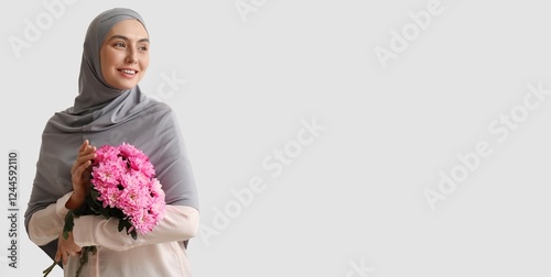 Happy Muslim woman holding ...