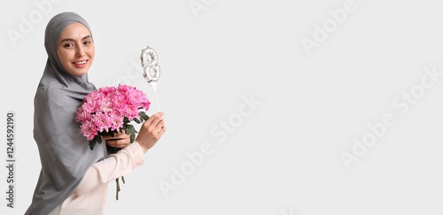 Happy young Muslim woman ho...