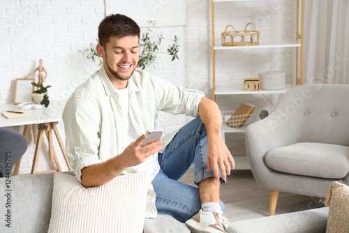 Young bearded man using mob...