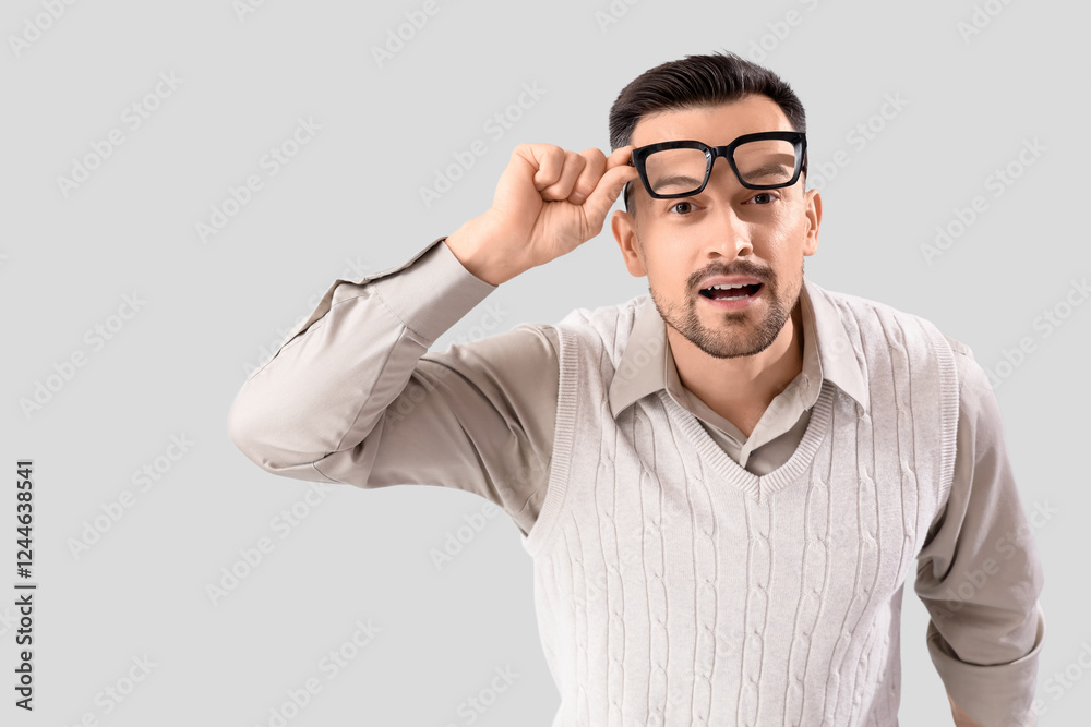 Handsome man with eyeglasses on light background Handsome man with eyeglasses on light background