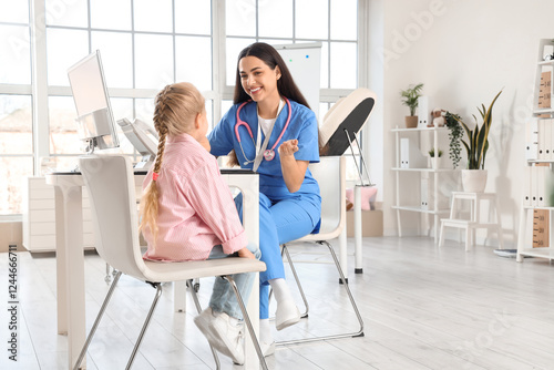 Female pediatrician working...