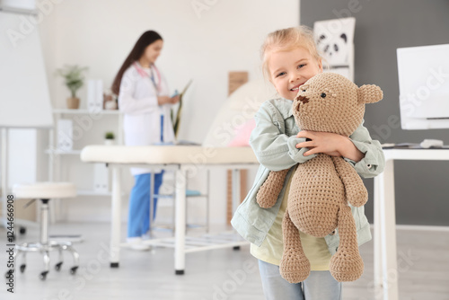 Cute little girl with toy b...