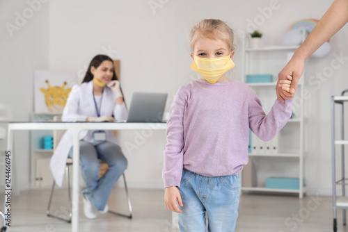 Little girl with mask and h...