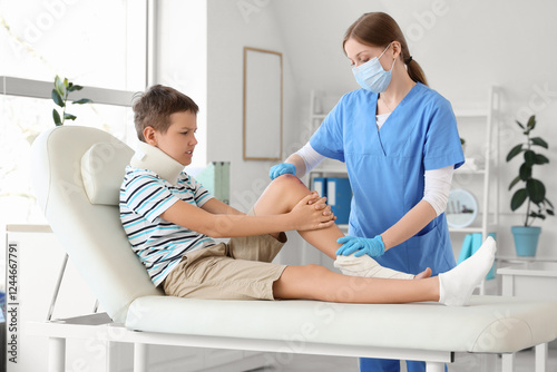 Young boy with neck brace a...