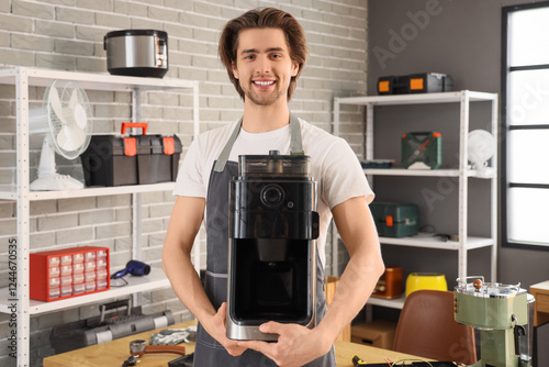 Male repairman with coffee ...