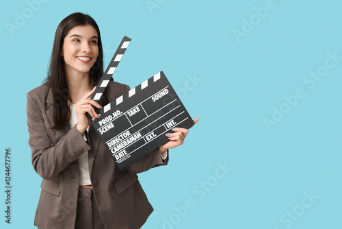 Young woman with movie clap...