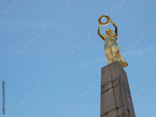 The Golden Lady (Gëlle Fra) on top of the Monument of Remembrance from 1923 to commemorate the Luxembourgers who perished in the First World War on Constitution Square in Luxembourg City Centre photo