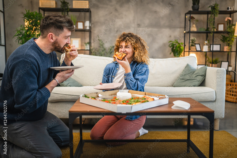 husband and wife eat pizza at home having time together with food husband and wife eat pizza at home having time together with food