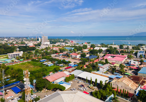 One part of Dili city seen from the height, residential and business area. Dili city is the capital of Timor Leste. Located on the coast and surrounded by hills. photo